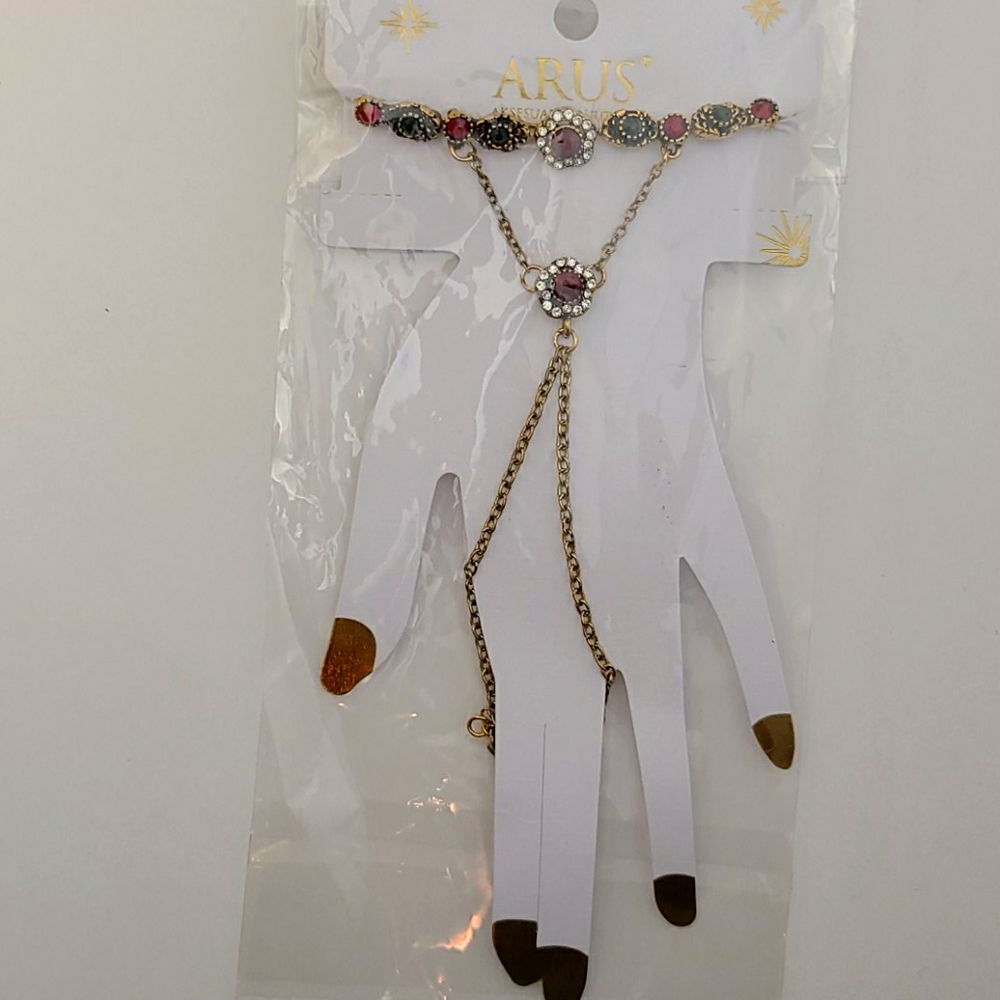 Gold colored chain finger bracelet